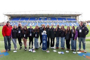 Junior grassroots football team at stadium